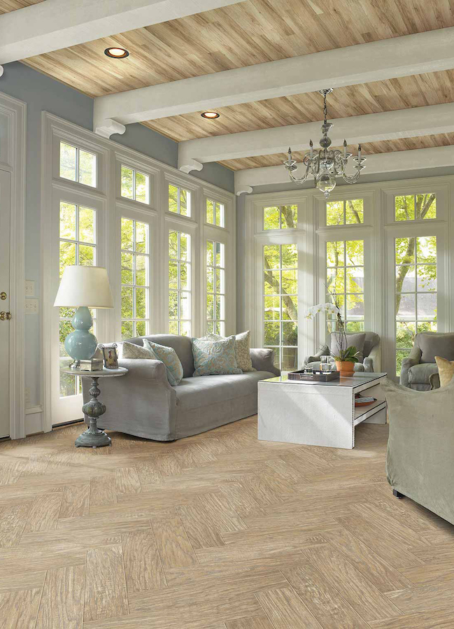 light toned wood look laminate in a bright living room with large windows
