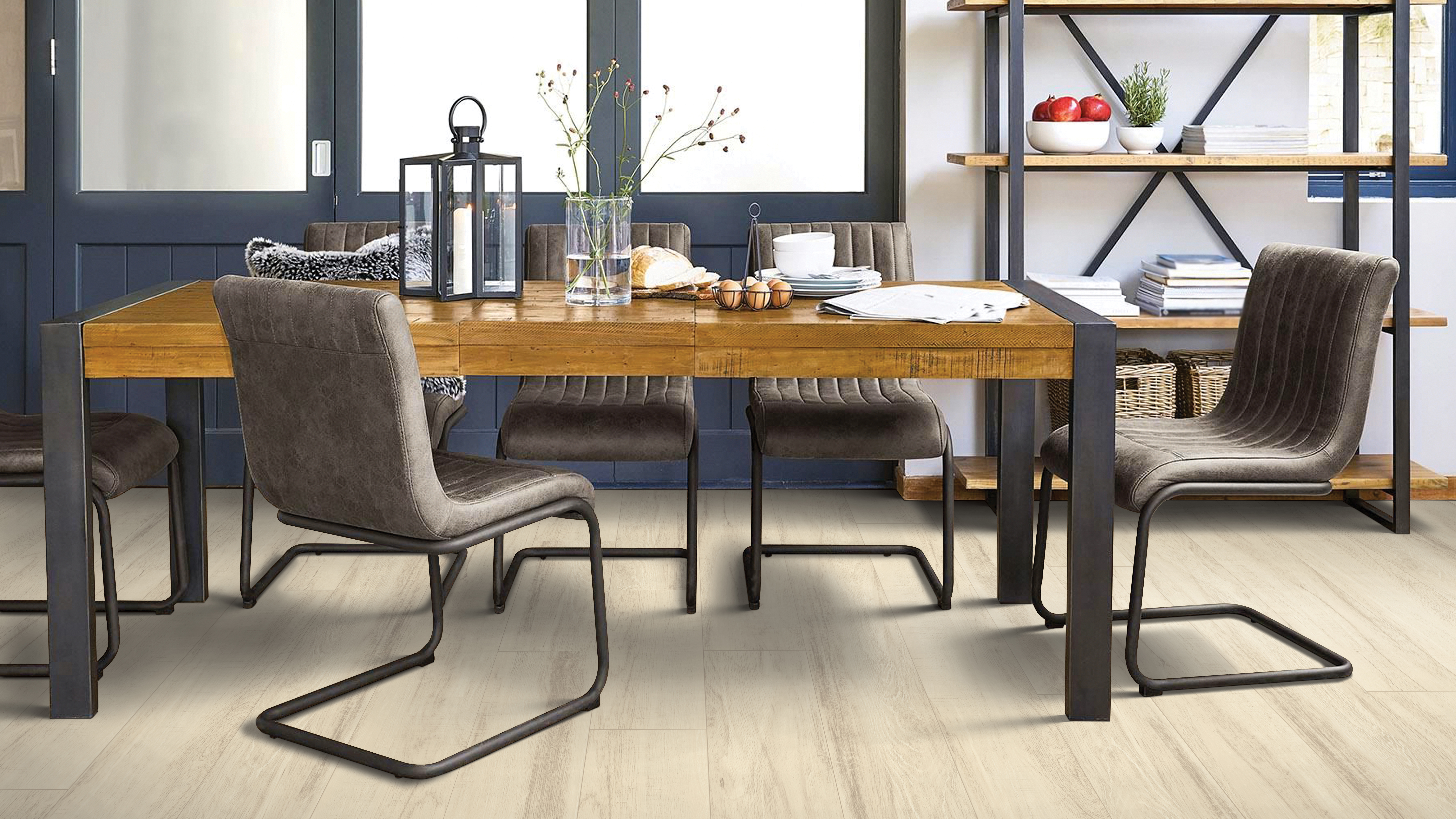 Luxury vinyl flooring in a dining room, installation services available.